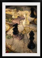 Chess pieces on old world map