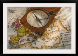 Antique compass on map