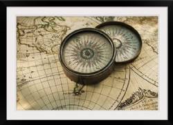 Antique compass on map