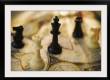 Chess pieces on old world map