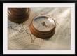 Antique compass on map